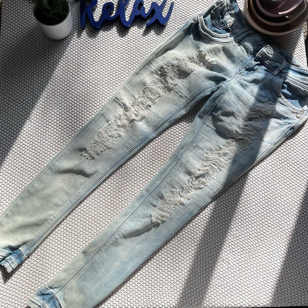 Skinny, ripped, denim jeans.